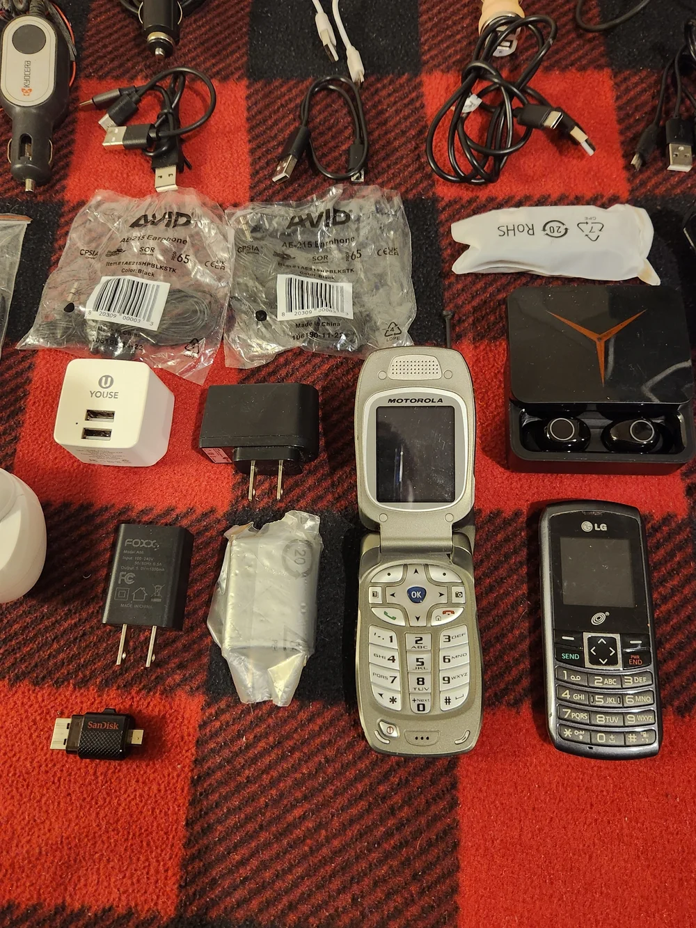 Elctronics Lot, Cellphones, Charging Cords, Remotes, And More